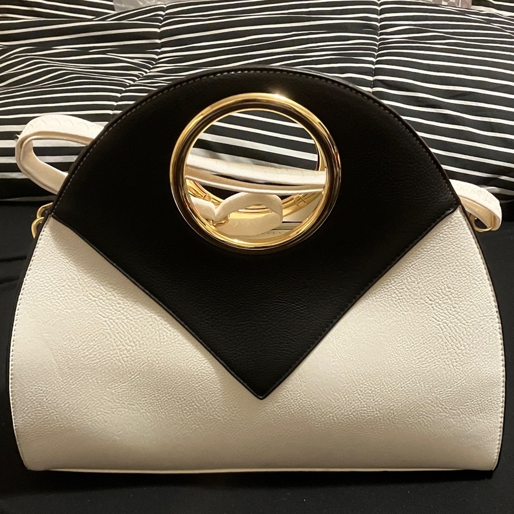 Chic Black and White Handbag with Gold Accent